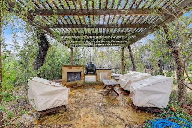 view of patio with fence, grilling area, and area for grilling
