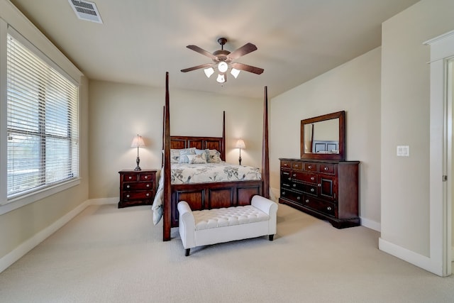 bedroom featuring visible vents, carpet flooring, baseboards, and a ceiling fan