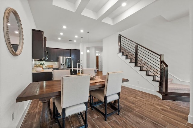 206 Olivia Dr Unit 120, Austin, TX 78738 - dining room with stairs, dark wood-type flooring, recessed lighting, and baseboards