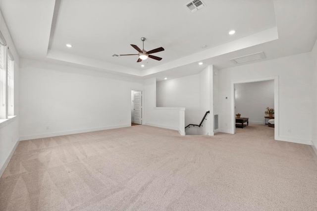 206 Olivia Dr Unit 120, Austin, TX 78738 - carpeted empty room featuring a tray ceiling, recessed lighting, ceiling fan, and baseboards