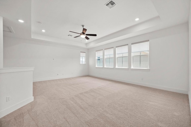 206 Olivia Dr Unit 120, Austin, TX 78738 - empty room featuring a raised ceiling, light carpet, baseboards, ceiling fan, and recessed lighting