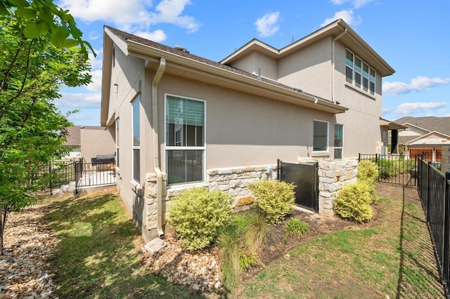 206 Olivia Dr Unit 120, Austin, TX 78738 - view of side of home featuring stone siding and stucco siding