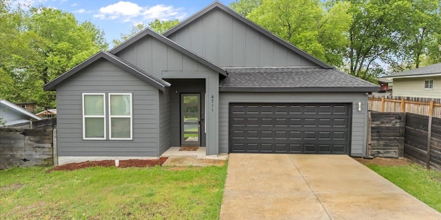 4711 Little Hill Cir, Austin, TX 78725 - view of front of property with board and batten siding, a garage, a shingled roof, and driveway