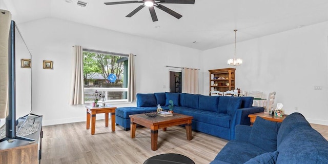 4711 Little Hill Cir, Austin, TX 78725 - living area with a ceiling fan, a chandelier, light wood-type flooring, vaulted ceiling, and baseboards