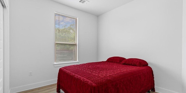 4711 Little Hill Cir, Austin, TX 78725 - bedroom with baseboards and wood finished floors