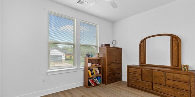 4711 Little Hill Cir, Austin, TX 78725 - bedroom with baseboards, visible vents, a ceiling fan, and light wood finished floors