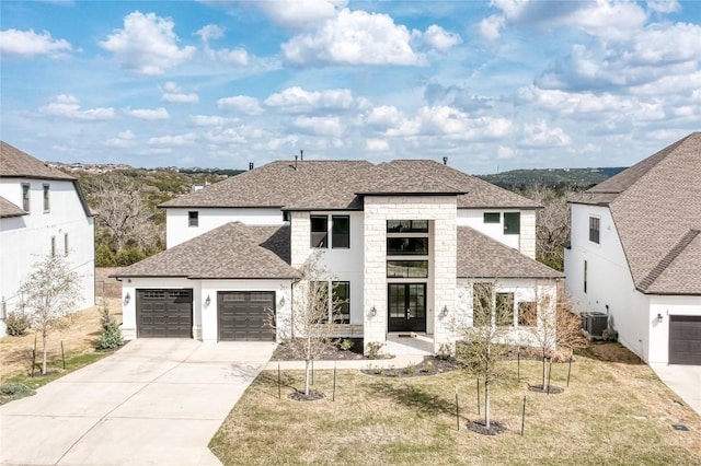 2420 Novara Trl, Leander, TX 78641 - modern home featuring stone siding, roof with shingles, driveway, an attached garage, and a front lawn