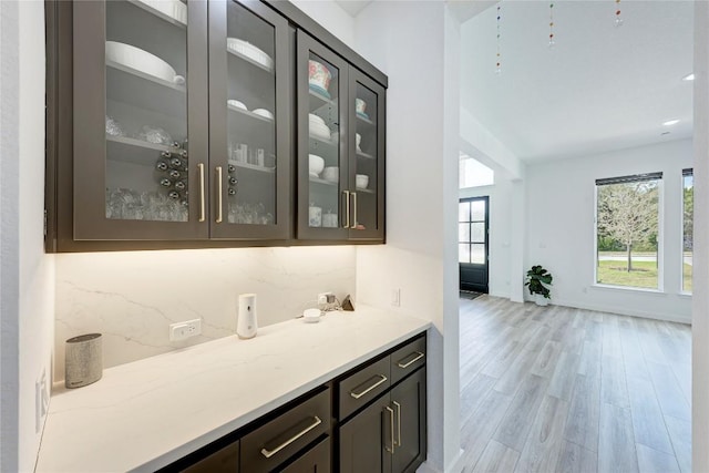 2420 Novara Trl, Leander, TX 78641 - bar area featuring healthy amount of natural light and light wood finished floors