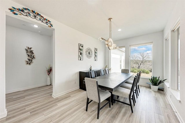 2420 Novara Trl, Leander, TX 78641 - dining space with light wood-style flooring, a chandelier, and recessed lighting