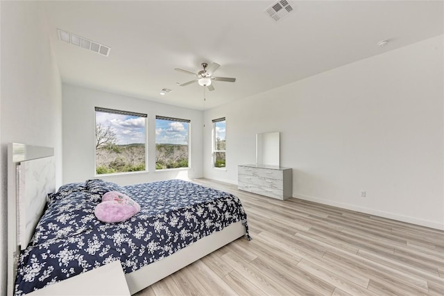 2420 Novara Trl, Leander, TX 78641 - bedroom with wood finished floors and ceiling fan