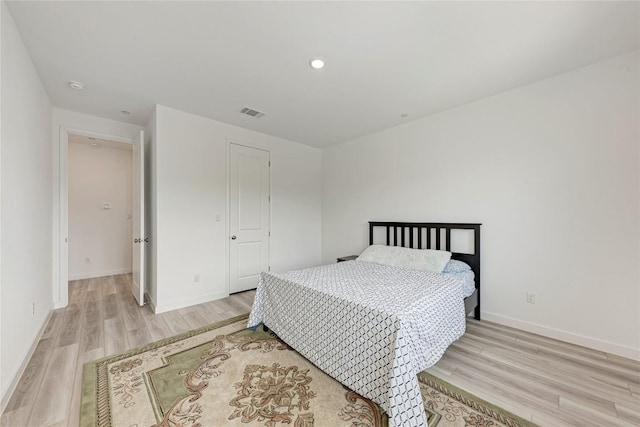 2420 Novara Trl, Leander, TX 78641 - bedroom with light wood-style flooring and recessed lighting
