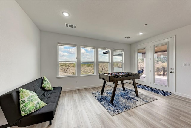 2420 Novara Trl, Leander, TX 78641 - playroom with light wood-style floors and recessed lighting
