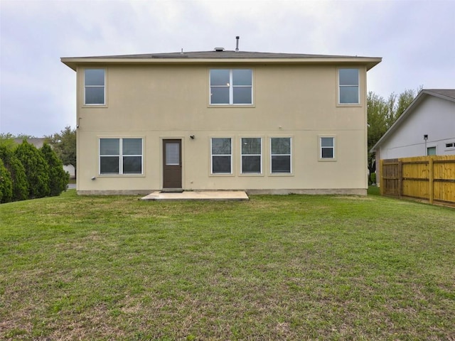 335 Dandelion Loop, Kyle, TX 78640 - back of house with a patio area and stucco siding