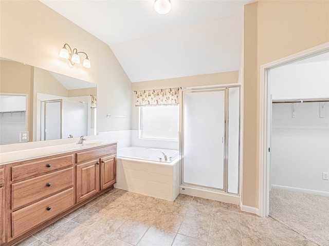 2009 Tillman Dr, Cedar Park, TX 78613 - bathroom with a walk in closet, a shower stall, vanity, and lofted ceiling