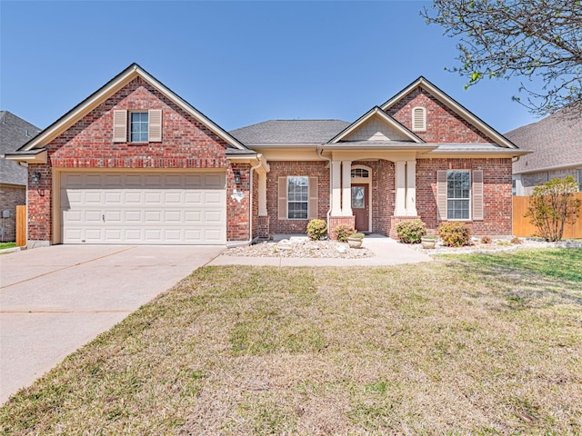 2009 Tillman Dr, Cedar Park, TX 78613 - view of front of property featuring concrete driveway, brick siding, and an attached garage