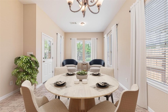 2009 Tillman Dr, Cedar Park, TX 78613 - dining area with a chandelier and light tile patterned floors