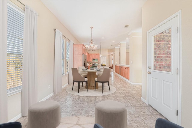 2009 Tillman Dr, Cedar Park, TX 78613 - dining room with a chandelier and light tile patterned floors