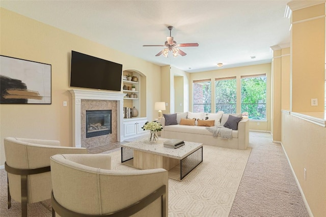 2009 Tillman Dr, Cedar Park, TX 78613 - living room with a tile fireplace, a ceiling fan, carpet floors, and built in shelves