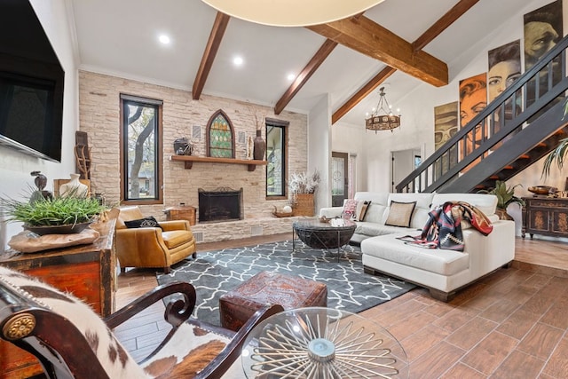 2906 Quail Run Dr, Round Rock, TX 78681 - living room featuring beam ceiling, stairway, wood finished floors, a chandelier, and a stone fireplace