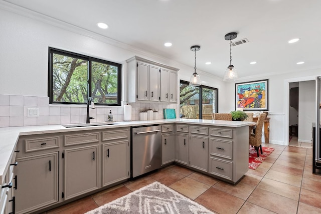 kitchen with stainless steel dishwasher, visible vents, a sink, and gray cabinets