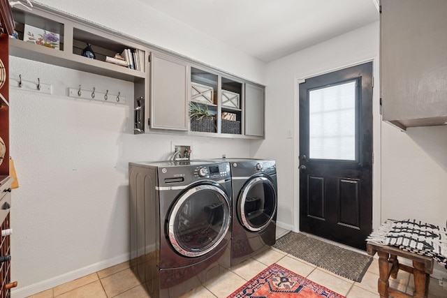 2906 Quail Run Dr, Round Rock, TX 78681 - laundry room with independent washer and dryer, light tile patterned flooring, and cabinet space