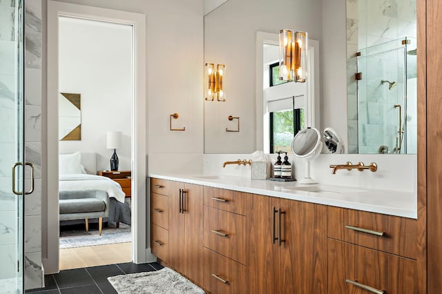 2116 Kenwood Ave, Austin, TX 78704 - bathroom featuring ensuite bath, double vanity, a shower stall, and tile patterned floors