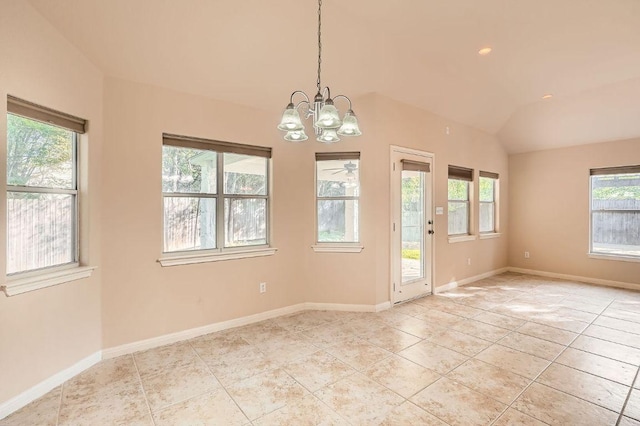 spare room with baseboards, vaulted ceiling, light tile patterned floors, and an inviting chandelier