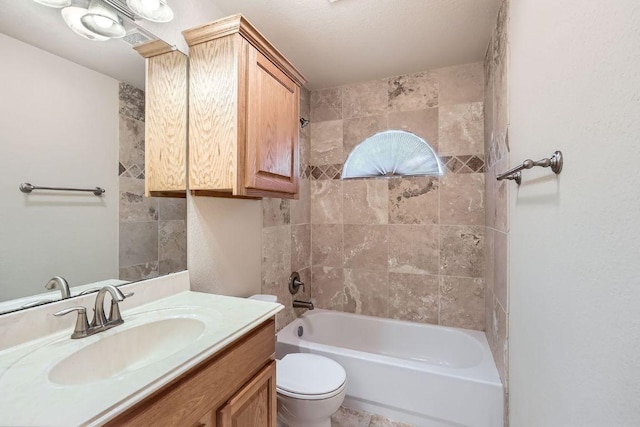 bathroom featuring tub / shower combination, toilet, and vanity