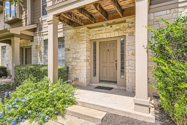 entrance to property with stone siding