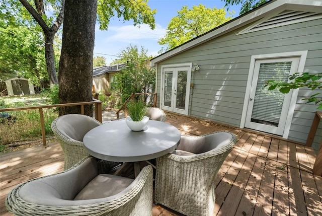 2108 Rountree Dr, Austin, TX 78722 - wooden terrace with outdoor dining space and french doors