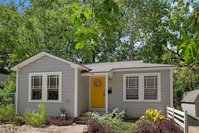 2108 Rountree Dr, Austin, TX 78722 - bungalow-style home with roof with shingles