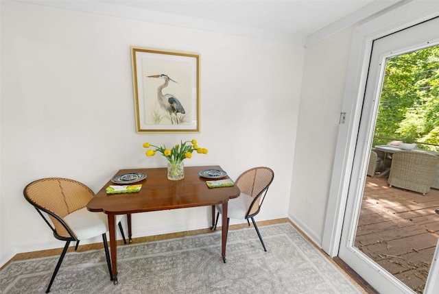 2108 Rountree Dr, Austin, TX 78722 - dining room featuring baseboards and light wood-type flooring
