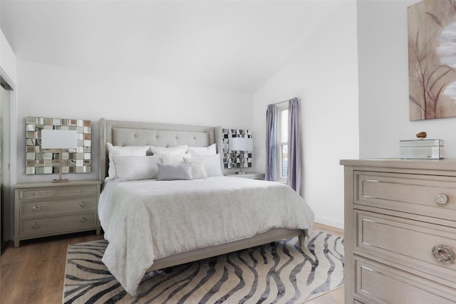 6307 Cannonleague Dr, Austin, TX 78745 - bedroom featuring wood finished floors and vaulted ceiling