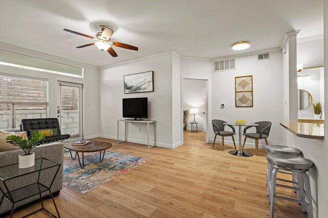 2209 Hancock Dr Unit 3, Austin, TX 78756 - living area with a ceiling fan, crown molding, and light wood-type flooring
