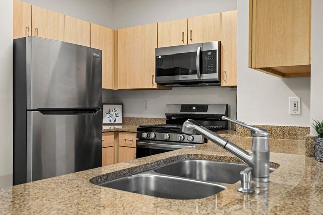 2209 Hancock Dr Unit 3, Austin, TX 78756 - kitchen featuring stainless steel appliances and light brown cabinets