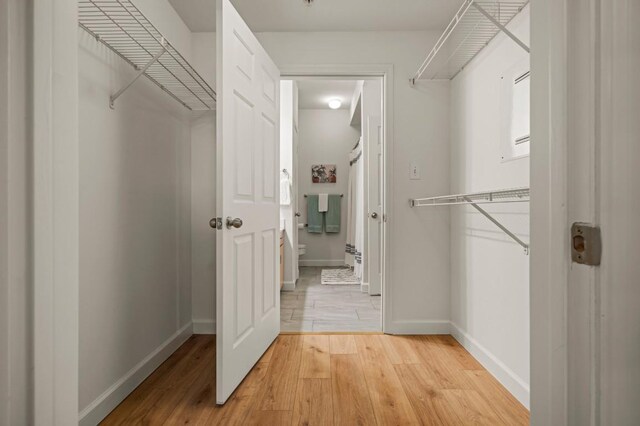 2209 Hancock Dr Unit 3, Austin, TX 78756 - walk in closet with wood finished floors