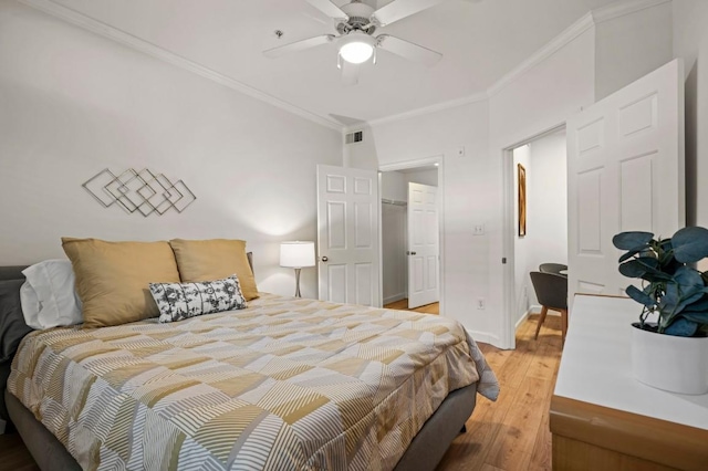 2209 Hancock Dr Unit 3, Austin, TX 78756 - bedroom with crown molding, light wood finished floors, a ceiling fan, and a walk in closet