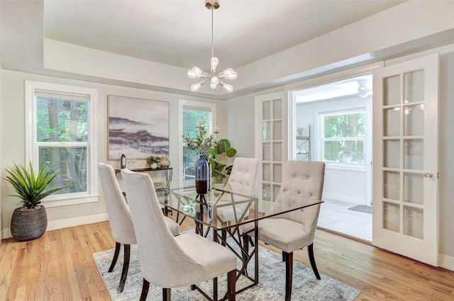 3902 Willbert Rd, Austin, TX 78751 - dining space with a chandelier, light wood-type flooring, and plenty of natural light