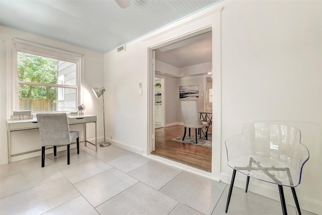 3902 Willbert Rd, Austin, TX 78751 - home office with baseboards and tile patterned floors