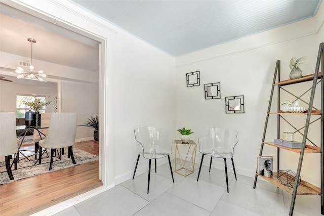 3902 Willbert Rd, Austin, TX 78751 - tiled dining space with a chandelier and baseboards