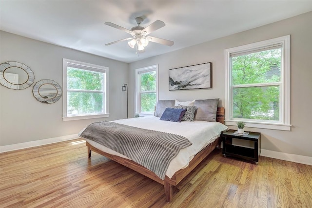 3902 Willbert Rd, Austin, TX 78751 - bedroom with baseboards, light wood finished floors, and a ceiling fan
