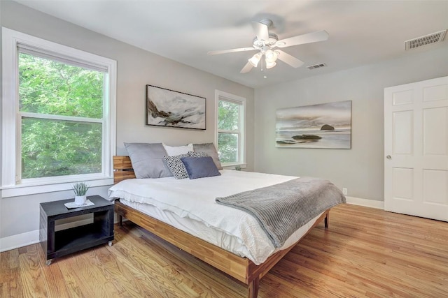 3902 Willbert Rd, Austin, TX 78751 - bedroom with baseboards, light wood finished floors, and a ceiling fan