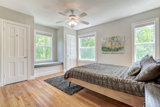 3902 Willbert Rd, Austin, TX 78751 - bedroom with wood finished floors, baseboards, and ceiling fan