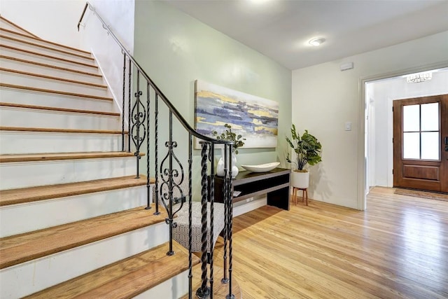 3902 Willbert Rd, Austin, TX 78751 - foyer entrance featuring stairs and wood finished floors