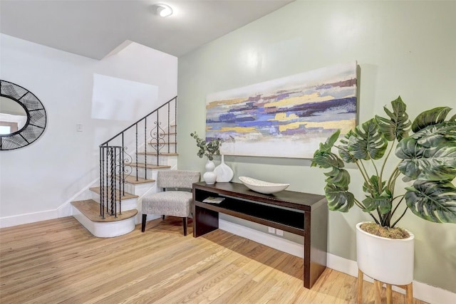 3902 Willbert Rd, Austin, TX 78751 - sitting room with wood finished floors, stairs, and baseboards