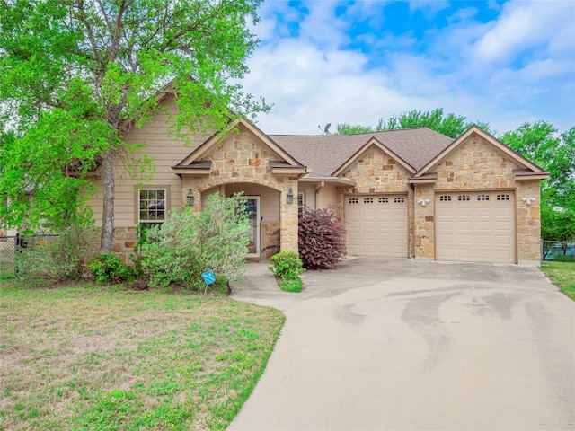 1008 Laurel Oak Cir, Marble Falls, TX 78654 - view of front facade featuring stone siding, driveway, and an attached garage