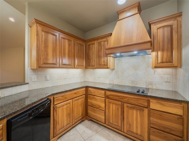 1008 Laurel Oak Cir, Marble Falls, TX 78654 - kitchen featuring custom exhaust hood, black appliances, dark stone counters, and brown cabinets