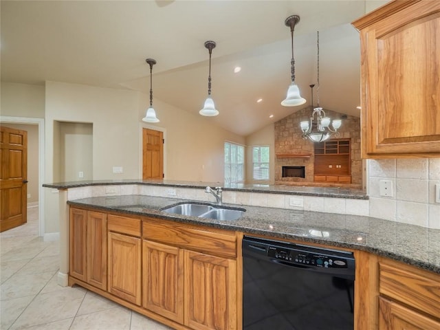 1008 Laurel Oak Cir, Marble Falls, TX 78654 - kitchen with black dishwasher, a sink, dark stone counters, lofted ceiling, and decorative light fixtures