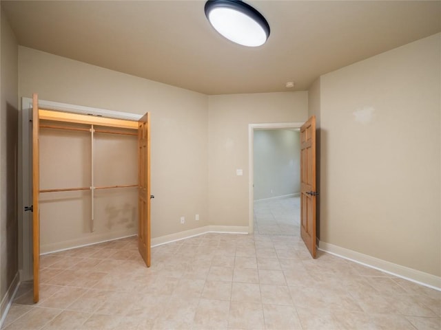 1008 Laurel Oak Cir, Marble Falls, TX 78654 - unfurnished bedroom with baseboards and light tile patterned flooring