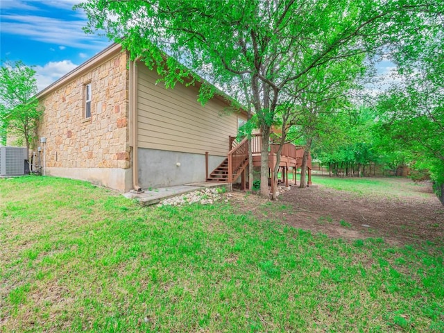 1008 Laurel Oak Cir, Marble Falls, TX 78654 - back of house featuring stairway, stone siding, central AC unit, and a deck